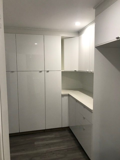 White built-in joinery with bench and overhead storage